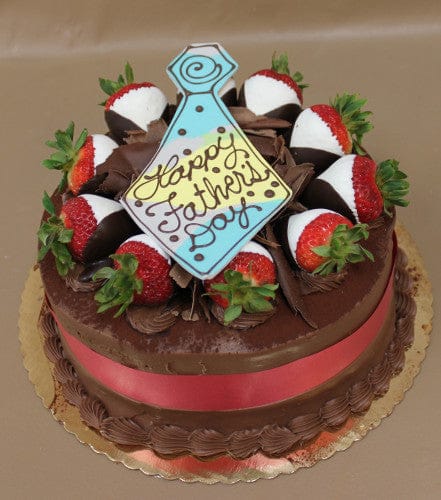 The FD-006 Tiramisu cake is decorated with chocolate-dipped strawberries, chocolate shavings, a red ribbon, and a tie-shaped cookie that says "Happy Fathers Day.