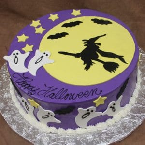 Product HW-006: A round purple Halloween cake decorated with yellow stars, ghosts, and a large yellow moon featuring a black witch silhouette. "Happy Halloween" is written in black script.