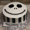 Celebrate with our HW-011 cake: a round Jack Skellington face from The Nightmare Before Christmas, featuring black side stripes and "Happy Birthday Tiffany" on a white base banner.
