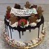 The ch-031 is a festive cake with white frosting, chocolate drip, strawberries, gingerbread men cookies, a “Merry Christmas” sign, sprinkles, and whipped cream on a gold tray.