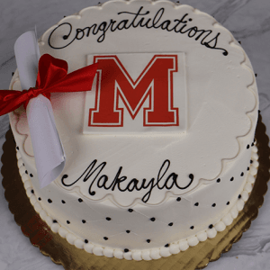 The GC-001H Milton High School cake features a white base with black polka dots, a scalloped edge, red "M" topper, rolled diploma with red ribbon, and "Congratulations Makayla" in black icing.