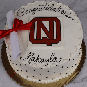 GC-001D North Quincy High School: Round white cake with scalloped edges, black dots, red and white school logo in center, diploma with red ribbon, and “Congratulations Makayla” written in black icing.