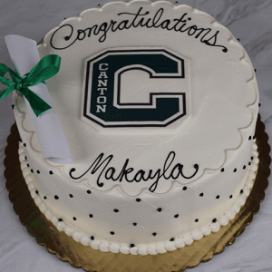 GC-001O Canton High School: A round cake with white frosting, black polka dots, "Congratulations Makayla," a large green C for Canton, and a diploma decoration with a green ribbon.