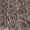 Rows of CO-046 Tea cookies dipped in chocolate, each topped with glossy raspberry jam and finished with a diagonal white chocolate drizzle, neatly arranged on a parchment-lined surface.