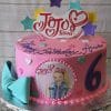 CB-009U is a pink JoJo Siwa-themed birthday cake with colorful stars, a turquoise bow, a large purple number 6, and a printed JoJo Siwa photo. “Happy Birthday Ava” is written in purple icing.