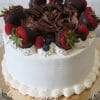 The BD-018D Triple Berry Cake features a white frosted finish, chocolate shavings, chocolate-covered strawberries, raspberries, and blueberries on a scalloped gold cake board.