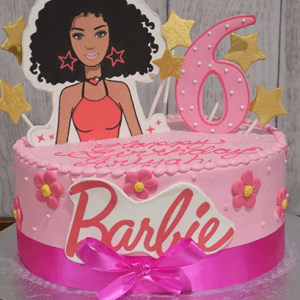 The CB-035B is a pink Barbie-themed birthday cake featuring a Barbie doll topper, gold stars, a large pink number 6, pink flowers, a ribbon bow, and "Barbie" written in bold letters on the side.