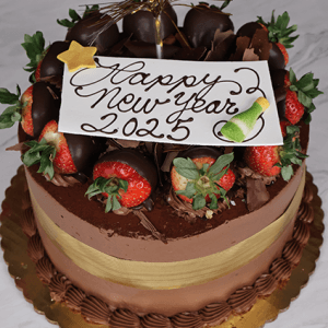 The NY-009 Tiramisu is a round chocolate cake topped with strawberries, chocolate-dipped strawberries, chocolate pieces, and a gold ribbon. A white plaque reads “Happy New Year 2025” with a star and champagne bottle illustration.