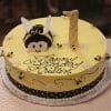 The CB-012J is a round yellow birthday cake with small bees, white flowers, a large bee face and wings, plus a number “1” topper. “Happy Birthday Kristin” is written in cursive icing.