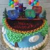 The SC-077 PJ Mask cake features a vibrant blue and green theme, decorated with trees, clouds, balloons, and PJ Masks character toppers. "Happy Birthday" is written in red icing on top.