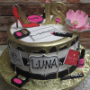 The BD-027B Designer Pink/Black is a round cake featuring gold accents, a pink high heel, large pink flower, makeup items, designer labels, a gold "18" topper, and "Luna" boldly displayed on the front.