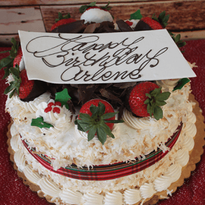 The CH-009 Display Pina Colada with Christmas Decor features a festive cake wrapped in ribbon, topped with whipped cream accents and colorful Christmas decorations for a cheerful celebration.