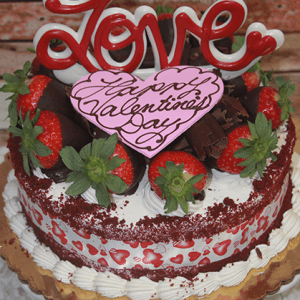 The VC-000D Display Red Velvet cake features strawberries, chocolate pieces, heart-shaped designs, a large red "Love" topper, and a pink heart with "Happy Valentine’s Day" written in elegant script.