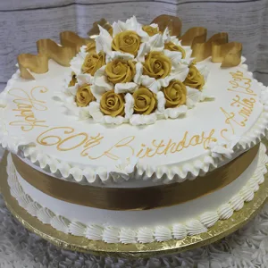 AN-004: A round white cake with gold and white icing roses, gold ribbon, and "Happy 60th Birthday Anita" piped in gold. Presented on a gold board with a decorative white border.