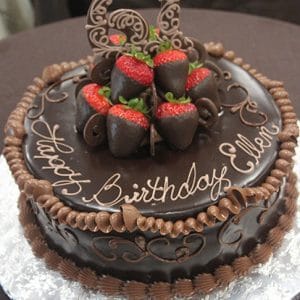 The BD-045 is a round chocolate cake with "Happy Birthday Ellen" in icing, topped with chocolate-covered strawberries and a chocolate "61" decoration, all presented on a foil-covered board.