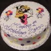 The CB-001J is a round birthday cake featuring colorful polka dots, balloons, and Minnie Mouse in a yellow dress, with “Happy 1st Birthday Zoe” written in purple icing.