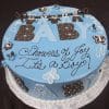 BB-019 is a round blue cake featuring butterflies, polka dots, and large BABY letters, with “Showers of Joy, It’s a Boy!” written in cursive on top.