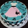 BD-063 Poodle Skirt Music Notes: Round cake with 1950s poodle skirt design—pink skirt, white top, black poodle, music notes, checkerboard border. Blue frosting reads "Happy 70th Nana! Keep Dancing!.