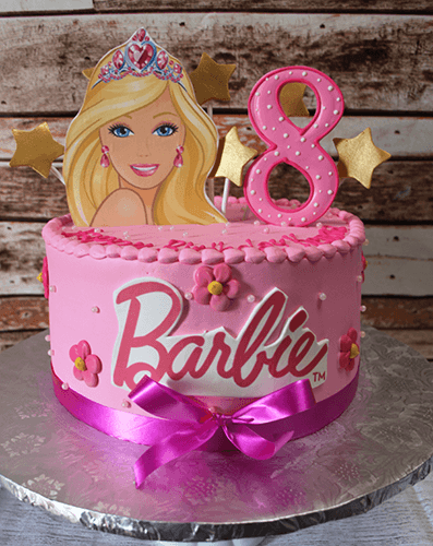 The CB-035A cake features a pink Barbie theme with a large Barbie image, pink number 8 topper, gold stars, pink flowers, and a purple ribbon bow on a silver cake board.