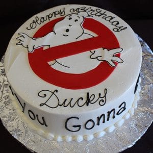 CB-010B is a round birthday cake with the Ghostbusters logo and “Happy Birthday Ducky” on top. The cake’s side features “Who you gonna call?” written in black icing.