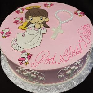 The RC-080 is a round pink cake featuring a kneeling praying girl cartoon, small winged birds, a rosary, “God Bless Laitta” in pink script, and white crosses decorating the sides.