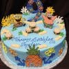 The CB-009J is a round blue cake with SpongeBob and Patrick, burger and sea-themed decorations, a large number 9 topper, and “Happy Birthday Taylon” in blue icing.