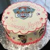 The CB-009I cake is round with a PAW Patrol logo on top, pink icing reading "Happy Birthday Princess Maya," images of PAW Patrol characters on the sides, and pink and purple dot decorations.