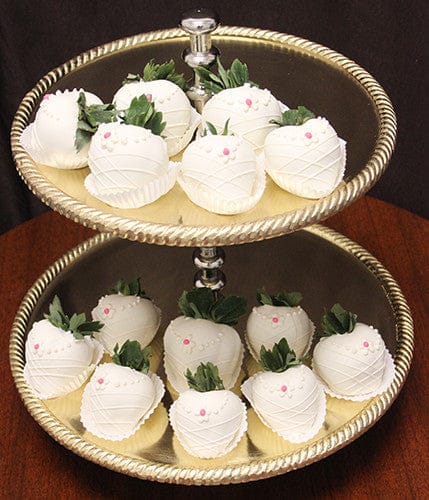 The ST-007-Bride Strawberries are white chocolate-dipped treats shaped like bunnies, featuring pink candy noses, dot eyes, and green leafy tops, beautifully arranged on a two-tiered gold serving tray.