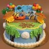 The SC-039 Minions birthday cake features tropical decorations with palm trees, umbrellas, balloons, and Minion figures for a beach theme. "Happy Southcoast Jobe" is written in red icing on the green top.