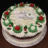 The CH-012 is a round Christmas cake with white icing, red and white frosting roses, green leaves, and a "Merry Christmas" script plaque. It is presented on a silver board.