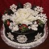 The CH-016 chocolate cake features white chocolate snowflakes, chocolate-covered strawberries, and white chocolate shavings atop a foil-wrapped base against a red background.