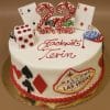 GR-013: A white cake featuring playing cards, poker chips, a large die, and a Welcome to Las Vegas sign, topped with a red “22” and “Jackpot! Tevin” in red icing.