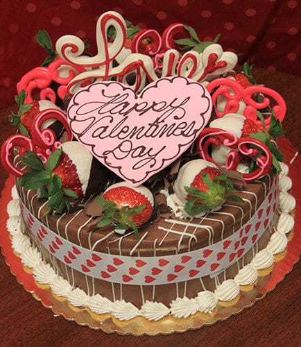 The VC-003 Display Chocolate Oreo Cake features chocolate-dipped strawberries, heart-shaped decorations, and a pink heart reading "Happy Valentine’s Day" on a gold platter with a red heart ribbon.
