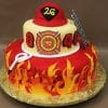 TC-155: Two-tiered cake with flames, fire department symbols, firefighter helmet on top labeled “26,” ladder, hook, “Boston Firefighters Local 718,” and numbers “8” and “48.”.