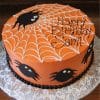 The HW-003 is a round orange birthday cake with white spiderweb icing, black fondant spiders, and "Happy Birthday Sami" on top, presented on a silver patterned board.