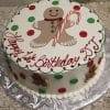 CH-027: Round cake topped with red and green polka dots, a smiling gingerbread man, and a candy cane. Sides feature small gingerbread men and “Happy 1st Birthday DJ!” written in red icing.