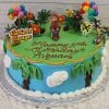 A vibrant SC-043 Curious George birthday cake features a George figurine, balloons, palm trees, flowers, and clouds. "Happy 2nd Birthday Avyaan" is written in red icing.