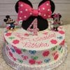 The CB-001A is a round birthday cake featuring Minnie Mouse ears, a pink polka dot bow, colorful flowers and bows, and Minnie and Mickey Mouse figures. “Happy Birthday Rithika” and a pink polka dot number 4 are on top.