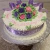 AN-006 is a round white cake topped with purple and pink icing roses, green leaves, and a purple ribbon. "Happy Birthday Mom" appears in pink icing on top. Presented on a silver platter.