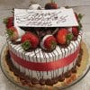 The BD-000C WHITE AND DARK DIPPED STRAWBERRIES is a round cake with a red ribbon, chocolate drizzle, chocolate shavings, and strawberries dipped in white and dark chocolate. A white plaque reads Happy Birthday Mom in elegant script.