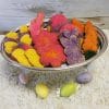 The CE-040a Easter set features a silver tray with bunny and butterfly sugar cookies, three pastel-speckled eggs on a textured white surface, and a wooden background for a festive touch.