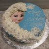The CB-008D is a round birthday cake featuring Elsa from Frozen, blue icing, white snowflakes, white frosting swirls, and "Happy 4th Birthday Wynn" written in white script.