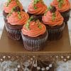 The CC-073 Pumpkin design cupcake features chocolate cake with white mousse filling, decorated to look like pumpkins with orange frosting and icing vines, and displayed on a gold stand with crystal accents.