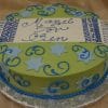 The RC-091 cake features blue and light blue Stars of David and swirls on green icing, topped with a rectangular plaque that says "Mazel Tov Ben" in blue script, accented by blue and white stripes at each end.