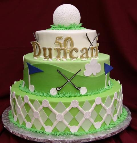 The TC-146 is a three-tiered golf-themed cake for a 50th birthday, decorated with golf balls, clubs, flags, and a large golf ball on top. "50 Duncan" is written in gold letters on the cake.