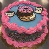 The CB-028E is a round cake with blue icing, pink frosting swirls, and colorful sprinkles on the sides. The top is decorated with a pink-iced donut and two smiling coffee cups.