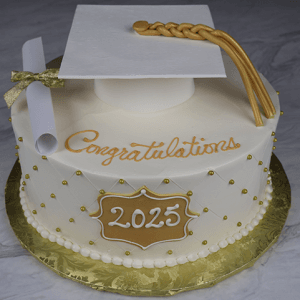 The GC-0006 is a round white graduation cake featuring a gold "2025" plaque, gold beads, a diploma, and a white cap with a gold tassel. "Congratulations" is written in gold icing on top.