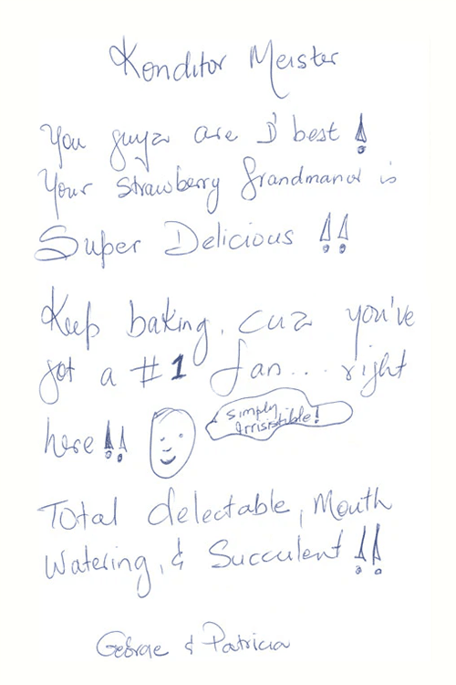 Handwritten customer note praising Konditor Meister’s strawberry grand marnier cake