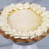 Ricotta pie is a traditional, creamy Italian dessert—often served during Easter—featuring a sweet, lemon-scented ricotta filling baked in a cookie-like pastry.