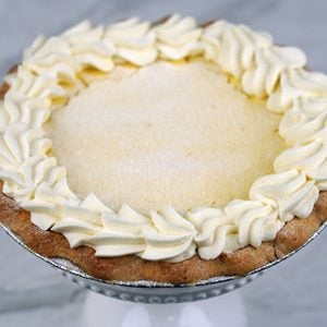 Ricotta pie is a traditional, creamy Italian dessert—often served during Easter—featuring a sweet, lemon-scented ricotta filling baked in a cookie-like pastry.